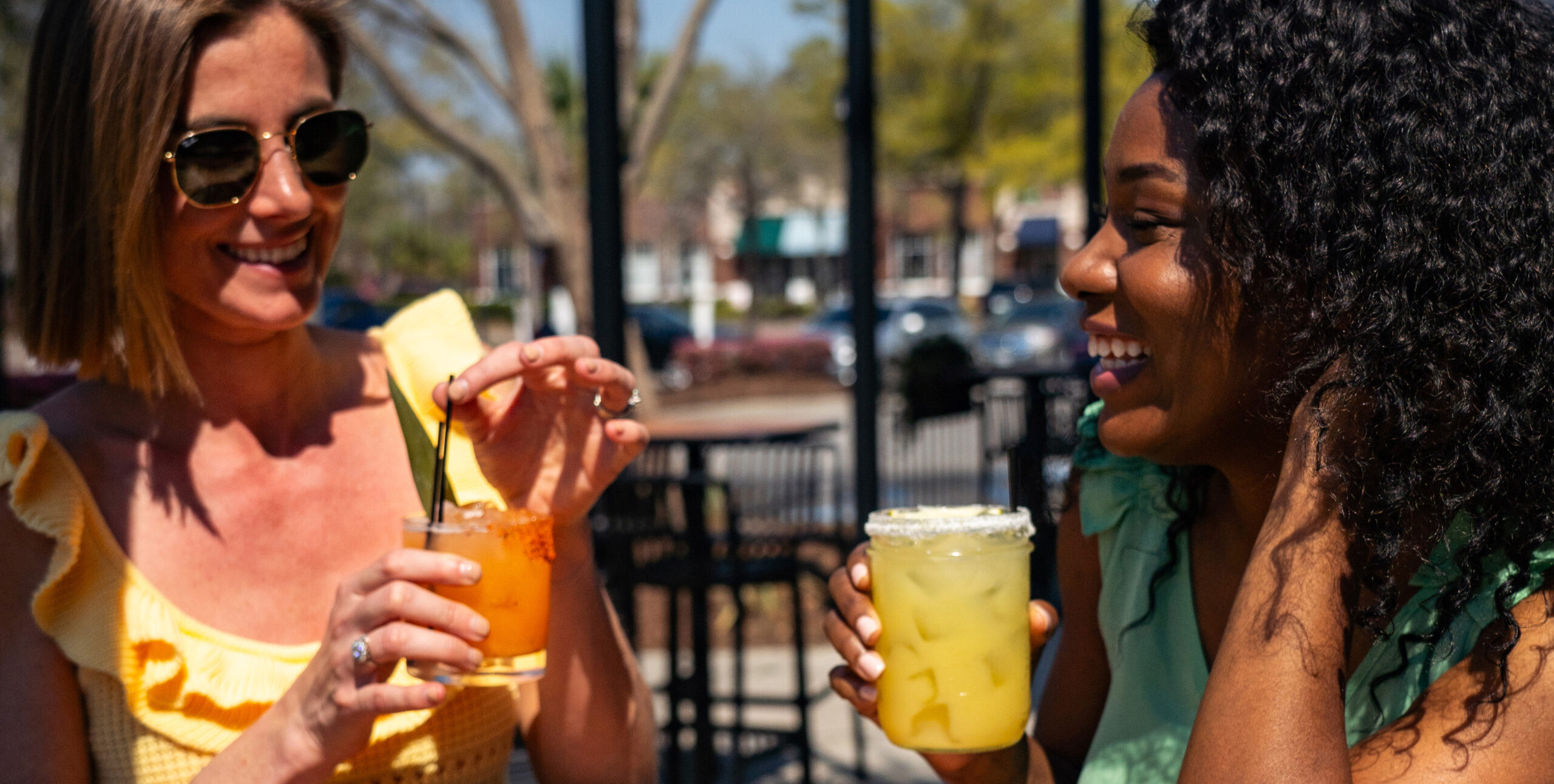 Home page Image 2 people enjoying drinks outside